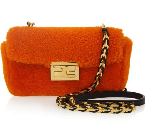 fendi orange shearling bag|Fendi pants.